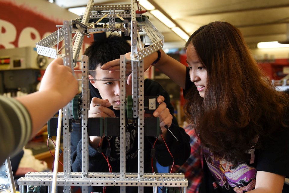 Xing Hao Li and Zoe Tsai are among 22 Gladstone secondary students headed to Kentucky next week to compete in an international robot-building battle. Photo Dan Toulgoet