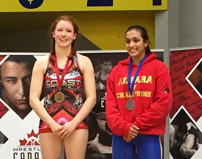 Burnaby's Sara Brinkac, at left, takes to the podium for the medal presentation with rival Kirti Saxena after last week's juvenile national final.