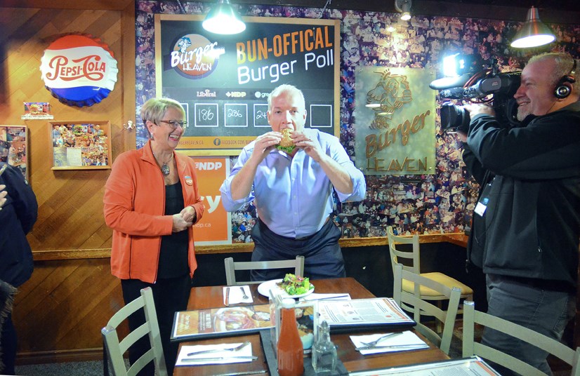 On the campaign trail: NDP leader John Horgan, right, joined New Westminster NDP candidate Judy Darcy for lunch at Burger Heaven in April.