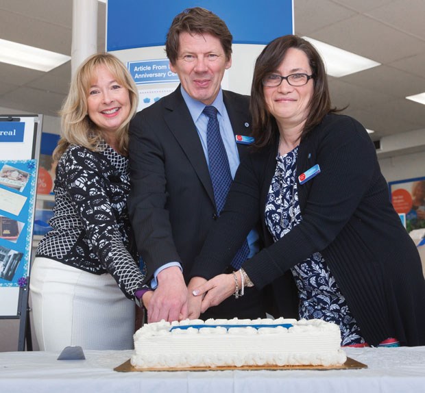 The Bank of Montreal celebrates 200 years in Canada, and 57 years in Tsawwassen, with a cake cutting last week. Coun. Heather King (left) joins regional VP Henry Donkers and branch manager Debbie DaSilva.
