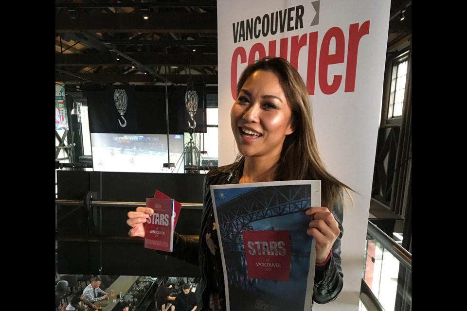 Celebrating the second-place win for best pet daycare, Marie Lim of Little Doggy Daycare poses for a photo at the announcement party at Steel Toad Brewery on April 26.