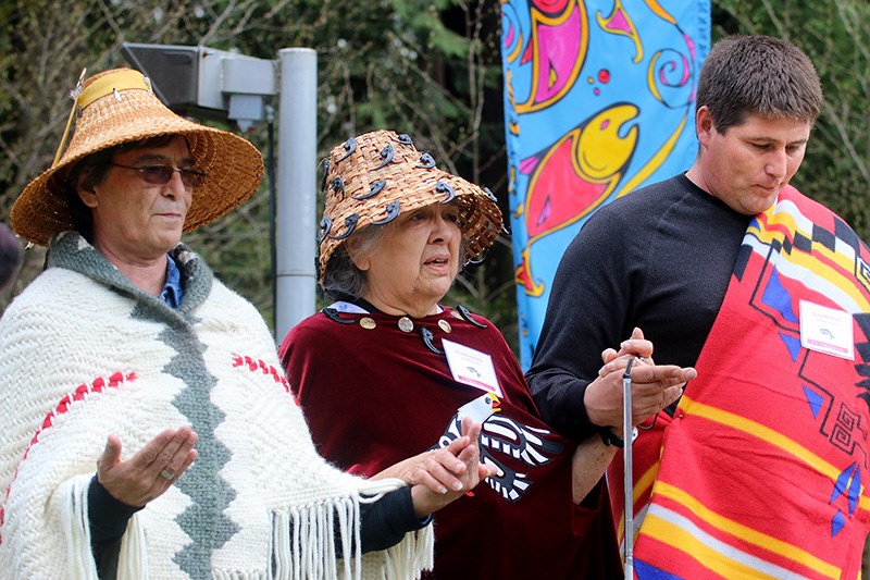 MARIO BARTEL/THE TRI-CITY NEWS
Kwikwetlem First Nation elder Bev Morzoczkowski, centre, offers a traditional blessing with councillors Fred Hulbert Sr. and John Peters prior to the release of 5,000 sockeye smolts into the Coquitlam River on Thursday. The release was the culmination of a two-year program by the Kwikwetlem Sockeye Restoration Program to rebuild the stock of Coquitlam kokanee after small numbers of returning adult fish were discovered annually in Department of Fisheries and Oceans' trap at the base of the Coquitlam Dam. The program was initiated when DNA testing confirmed the majority of the fish were survivors of the stock that had long been thought eliminated when the damn was reconstructed and enlarged in 1913. The smolts were raised at the Rosewell Hatchery on Vancouver Island and it's hoped they'll return as adults in 2019. Thursday's release was the largest of Coquitlam sockeye in more than 100 years.
