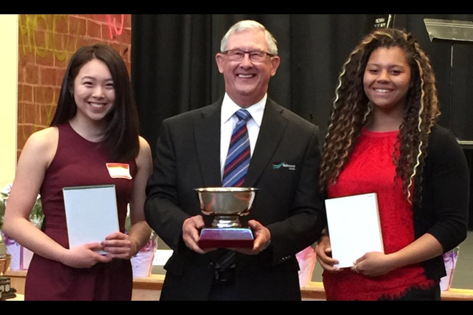 Bianca Go (left) and Camryn Rogers are presented the Youth Female Athlete of the Year Award from Councillor Bill McNulty on Thursday night at the 18th annual Richmond Sports Awards.