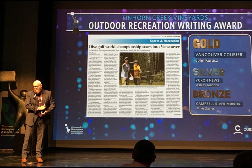 City editor Michael Kissinger accepts a gold writing award on behalf of reporter John Kurucz who was unable to attend the April 29 Ma Murray awards gala at River Rock Casino.