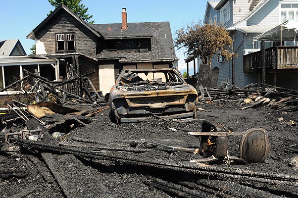 A house on West 35th near Maple was the scene of a suspicious fire early Thursday morning.Catherine Brennan Schwarz was alerted to the fire by Dulce, standard poodle.