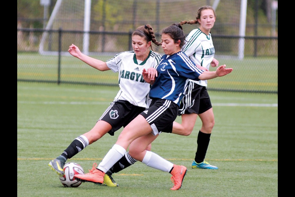 Argyle’s Lauren Parr and Sentinel's Tara Abolfathi battle for the ball while Sydney Hills provides support during a 4-1 for Argyle in North Shore senior girls AAA action April 19 at Ambleside Park. photo Paul McGrath, North Shore News