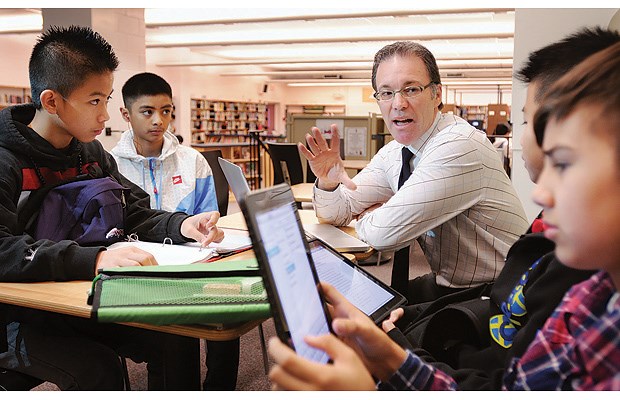 John Oliver secondary principal Gino Bondi says his school's digital literacy classroom, where students use iPads for class assignments, is the tip of the iceberg.