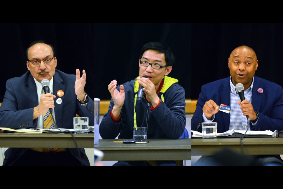 From left, Burnaby-Edmonds candidates Raj Chouhan (NDP), Valentine Wu (Green) and Garrison Duke (B.C. Liberal) face off during an all-candidates meeting at Stride Avenue Community School Tuesday.