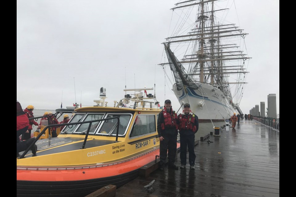 RCMSAR crew at the Kaiwo Maru dock Wednesday, at Garry Point Park, where members will be giving a tour of their own boat and loaning lifejackets to children attending the tall ships event. Photo by @Richmond_BC