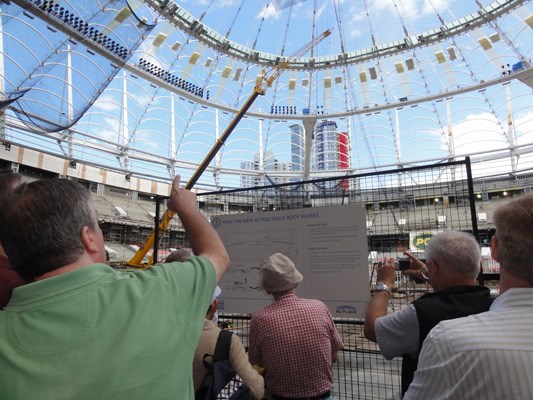 The west end of B.C. Place Stadium is covered by new fabric roofing, but crews are hurrying to finish the rest by Sept. 30. B.C. Pavilion Corporation reported 10,800 people attended the three-hour open house on Sunday. They saw 13 of the 36 fixed fabric roof panels in place and nearly half the 54,500 seats installed.