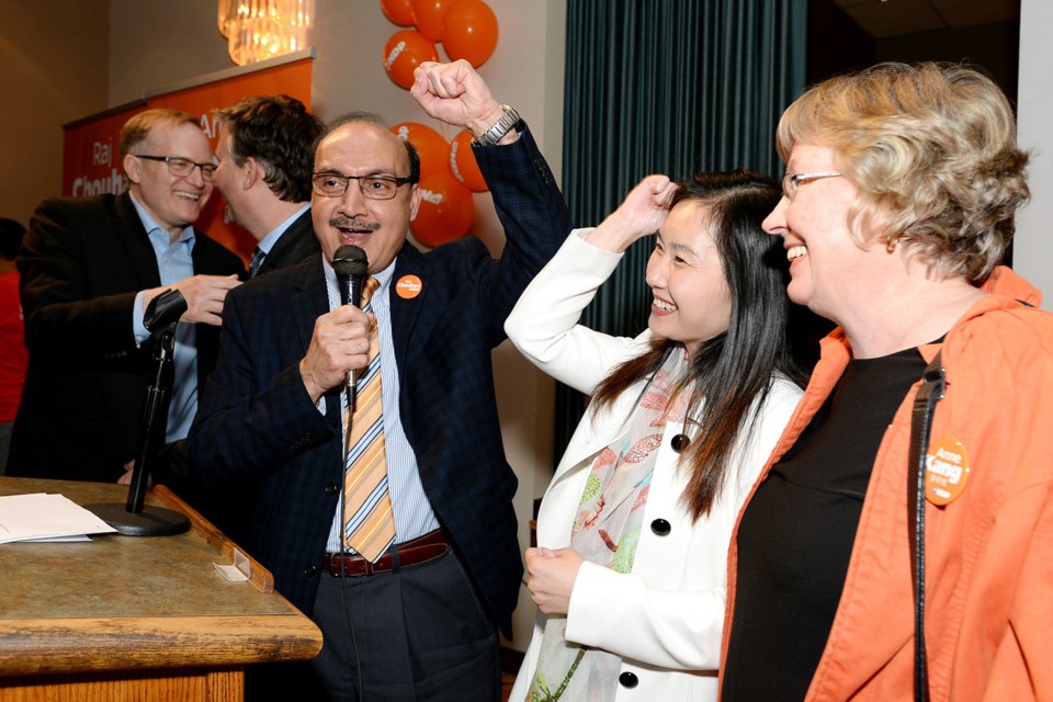 Raj Chouhan and Anne Kang celebrate their victories, watched by retiring Burnaby-Deer Lake MLA Kathy Corrigan.