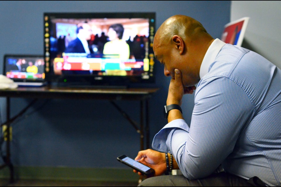 B.C. Liberal candidate for Burnaby-Edmonds Garrison Duke watches the returns on election night.