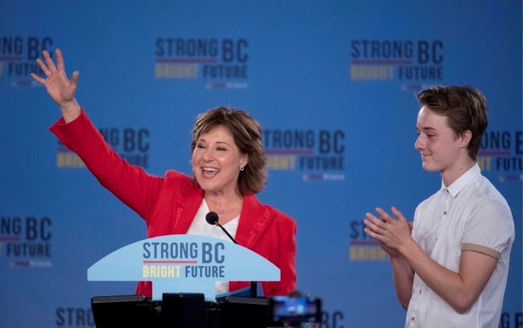 B.C. Liberal Leader Christy Clark and her son Hamish are greeted by supporters in Vancouver as she prepares to make a speech about the close vote.