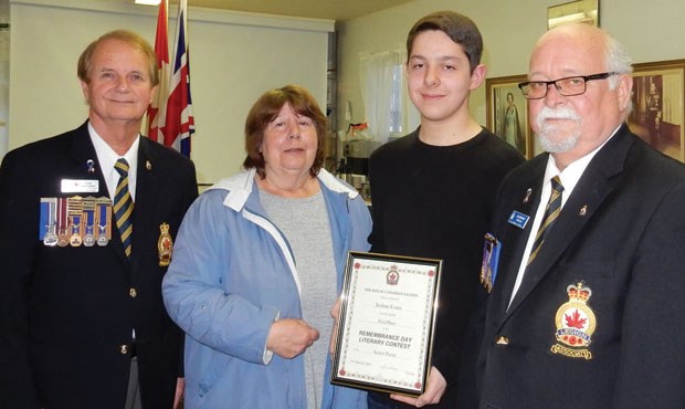 The Ladner Legion recently presented an award and cheque to Joshua Costa for winning first place in the Remembrance Day Literary Contest in the Legion Peace Arch Zone. Pictured (from left) are zone commander Dale Johnson, committee chair Audrey Gordon, Joshua Costa and Legion president Al Ridgway.