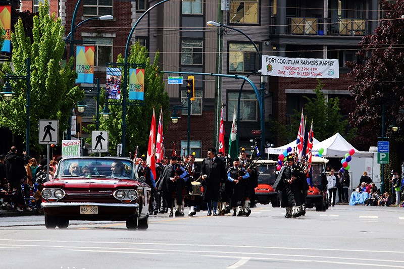 The colour party and pipe band for the PoCo Legion branch.