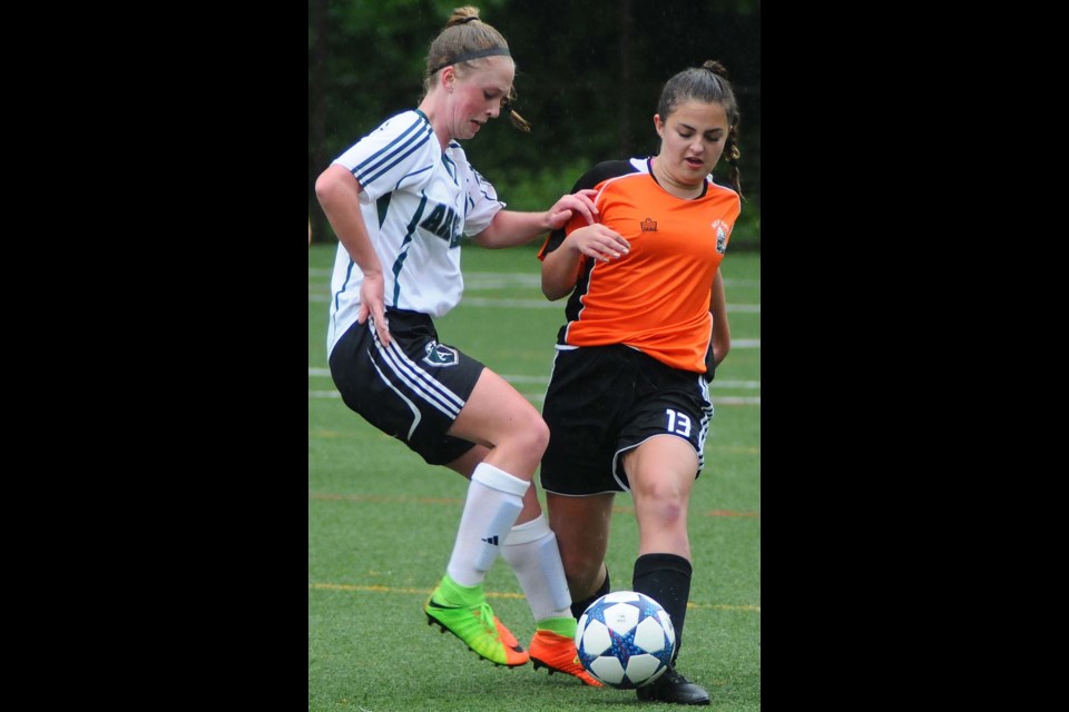New Westminster's Georgia Brydon battles an Argyle opponent for the ball during action on Monday. The playoff game pitted the Hyacks against the No. 1 team from the North Shore, whose roster included numerous metro and high performance league players, and ended in a 4-0 loss.