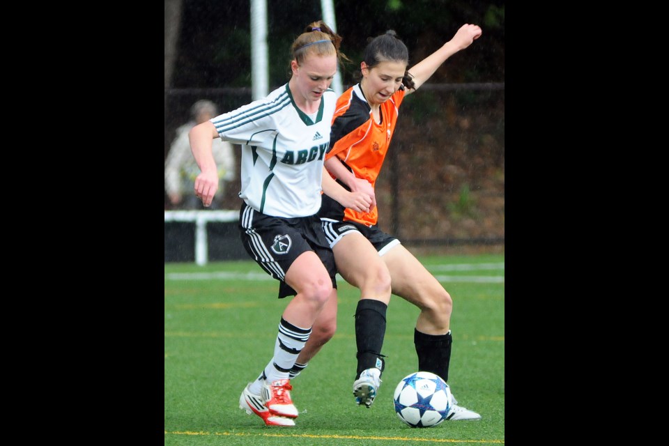 The New Westminster Hyacks' Sarah Forgie leans into her Argyle opponent during action Monday at the senior girls soccer playoff game. A 4-0 loss ended New West's hopes of advancing to the provincial championship tournament.