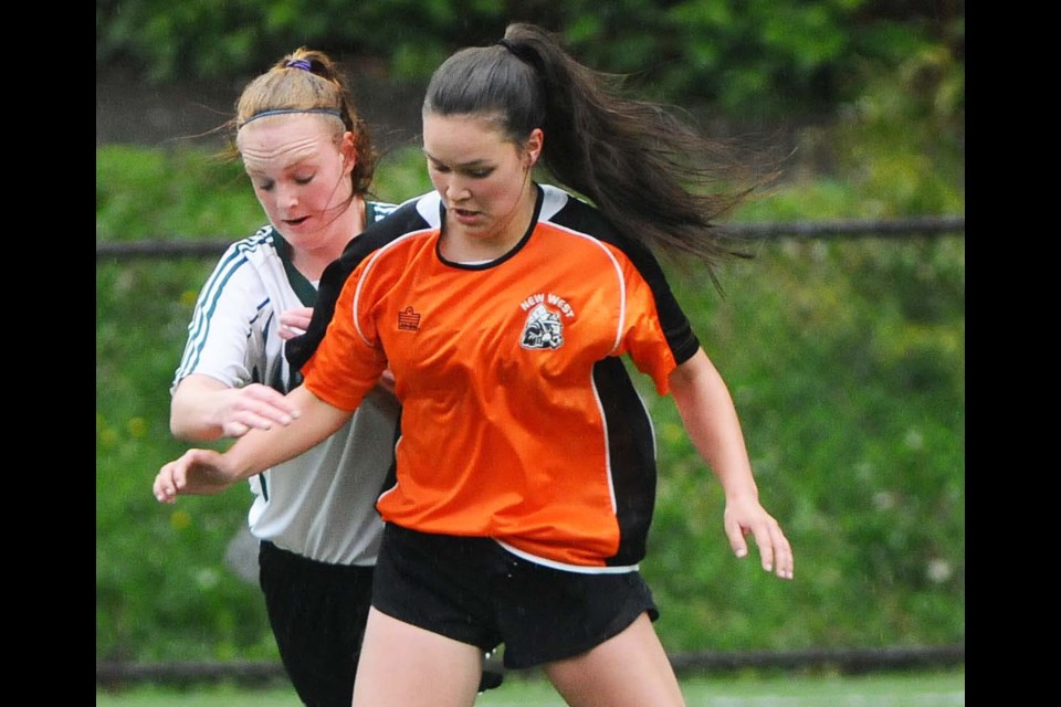 New Westminster's Brianne Lowka battles her Argyle rival for position during action Monday in the teams' playoff game.