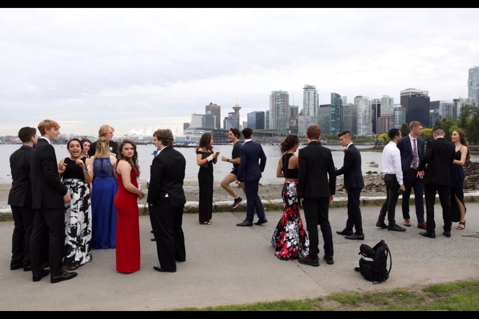 Prime Minister Justin Trudeau was jogging by a group of celebrating high school students on the Vancouver Seawall when they asked him to join them in a photo.