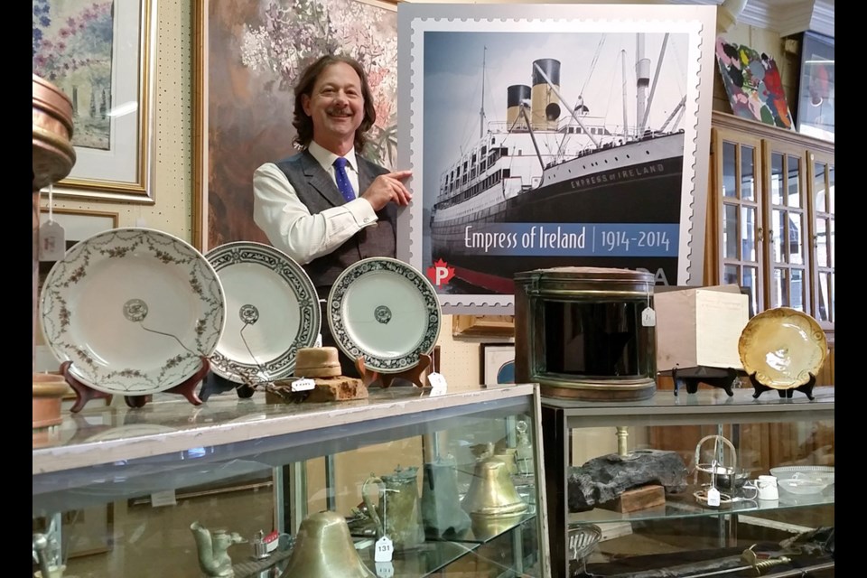 Peter A. Boyle, president of Lunds Auctioneers and Appraisers, with artifacts from the Empress of Ireland. Photograph courtesy Lunds