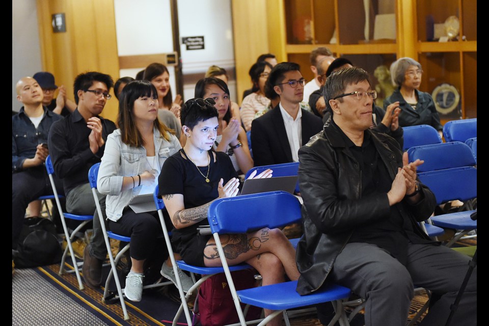 Residents wait to speak Monday at one of four public hearing sessions held at city hall on a 12-storey residential development planned for property at Keefer and Columbia streets in Chinatown. Photo Dan Toulgoet