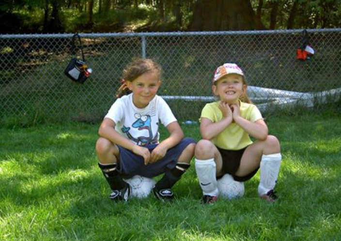 Matilda Shapland and Emily Carlington at the beginning of their soccer careers. Both of them have been recognized for their abilities by the West Vancouver Soccer Club and both are now playing on the same Adult Co-Ed teams as their dads.