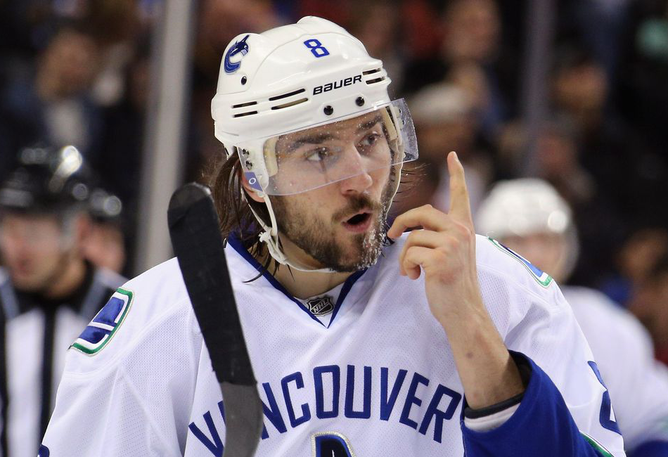 Chris Tanev points up