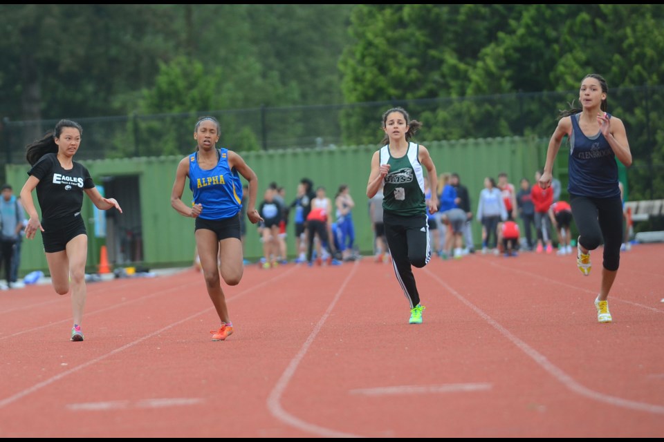 It's a Grade 8 girls' world, as some of the best marks for local schools were recorded by young runners, like from second-from-left Kelsey Kanyamuna of Alpha, Burnaby Mountain's Hannah Vorell, and Glenbrook's Anja Tjernagel, shown at the zone championships.