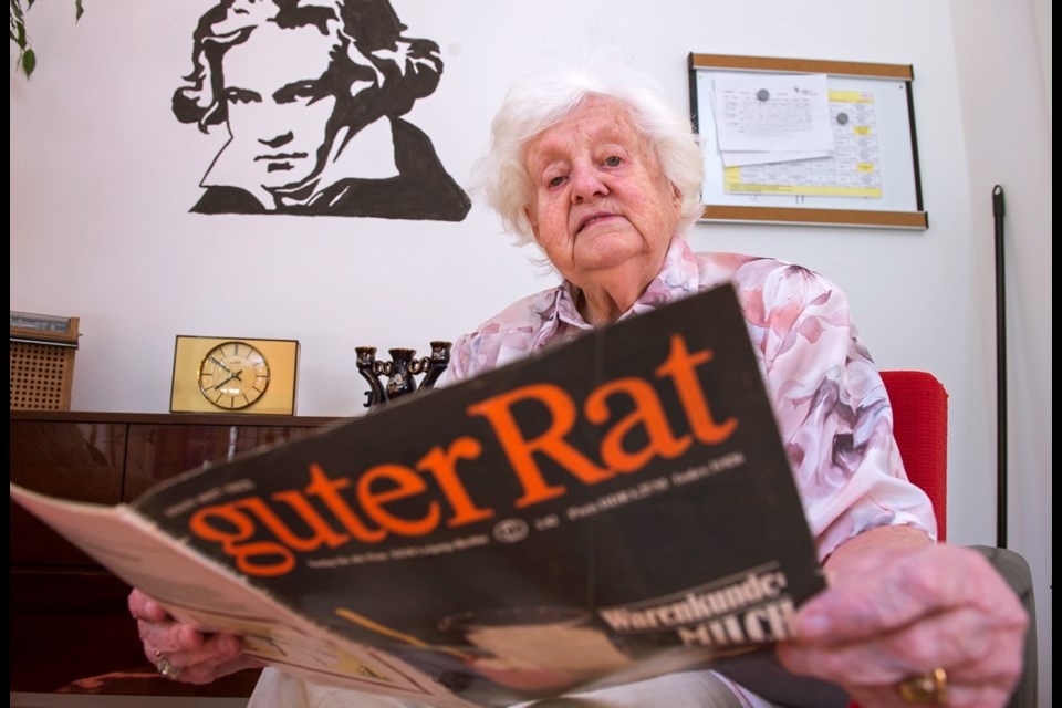 A resident reads a magazine from Communist-era East Germany at the Alexa Seniors' Residence in Dresden.