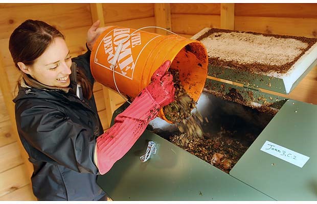 Charlotte Fesnoux of the Strathcona Green Zone Resource Park adds ground up food waste to the composter. The hub wants to compost an estimated 180 kilograms of food waste and food soiled paper products daily.