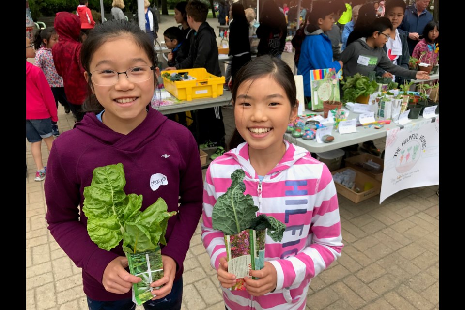 Students from Quilchena elementary school set up their Farmers' and Artisans market outside the Brighouse Library on Tuesday to help raise funds for local charitities, as well as learn more about community outreach. Photo by Philip Raphael/Richmond News