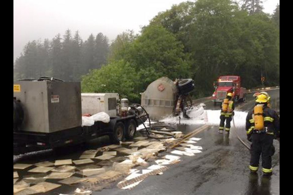Ucluelet volunteer firefighters respond to a fuel spill on Highway 4, near Kennedy Lake about 33 kilometres east of Ucluelet, on Thursday, June 15, 2017.
