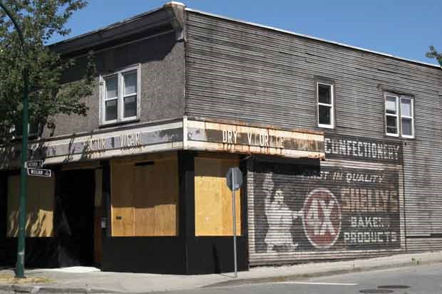 This photo, taken on Tuesday, shows a 1920s sign on a building at Victoria Drive and William Street advertising Shelly's 4X Bakery Products.