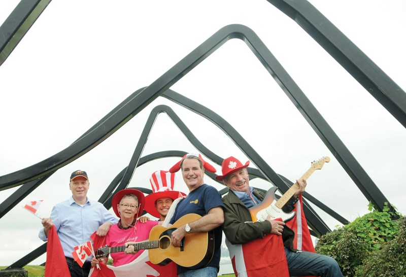 Event organizers and Rotarians Stan van Woerkens, Shirley Robertson, Malcolm Suarez, Kevin Evans and Roger Thomey are ready to get Waterfront Park rocking on Canada Day with a free concert and beer garden. photo Mike Wakefield, North Shore News