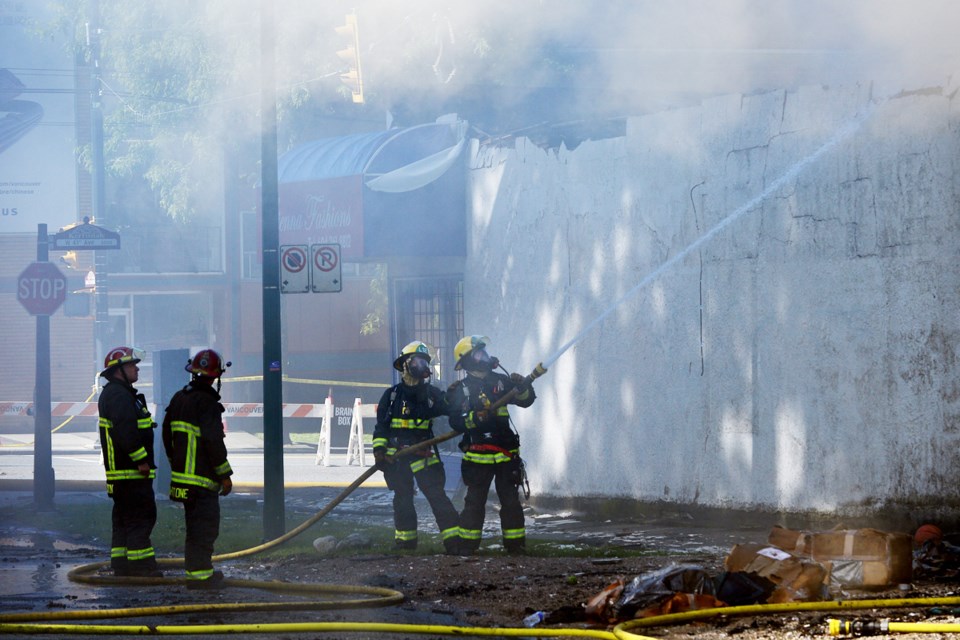 Vancouver firefighters were still dealing with flare-ups on Friday morning. The building is going to be torn down.