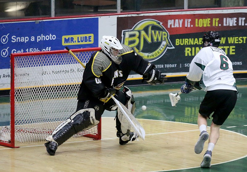 MARIO BARTEL/THE TRI-CITY NEWS
PoCo Saints goalkeeper Cam Overby makes one of his 36 saves on Burnaby Lakers forward Liam Macintosh in the first period of their BC Junior A Lacrosse League game, Monday at Copeland Arena. The Saints won the game, 14-10.