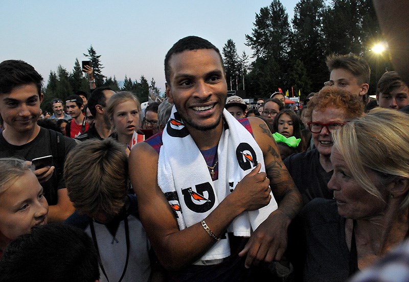 MARIO BARTEL/THE TRI-CITY NEWS
Canadian sprinter Andre De Grasse is mobbed by fans after winning the men's 100m at Wednesday's Harry Jerome Classic at Percy Perry Stadium. His winning time was 10.17.