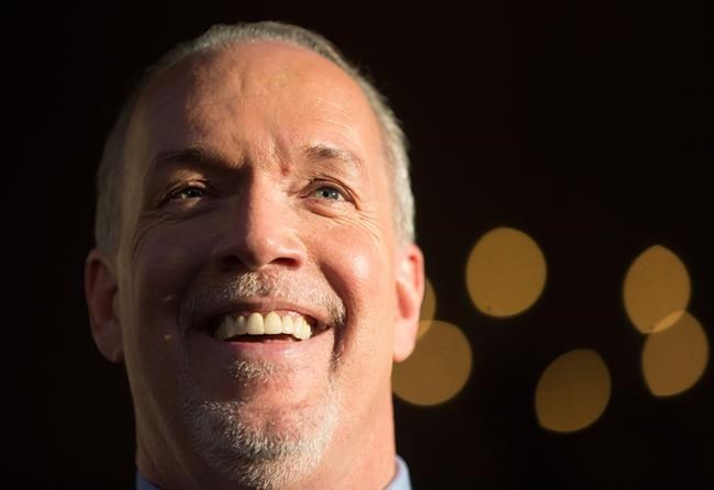 British Columbia Premier-designate, NDP Leader John Horgan smiles while speaking outside Government House after meeting with Lt-Gov. Judith Guichon in Victoria, B.C., on Thursday, June 29, 2017. THE CANADIAN PRESS/Darryl Dyck