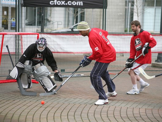 Canucks alumni, Vancouver firefighters, local celebrities, cancer survivors and hockey fans gathered outside Rogers Arena today at noon for a "Road hockey to conquer cancer" pick-up game.
