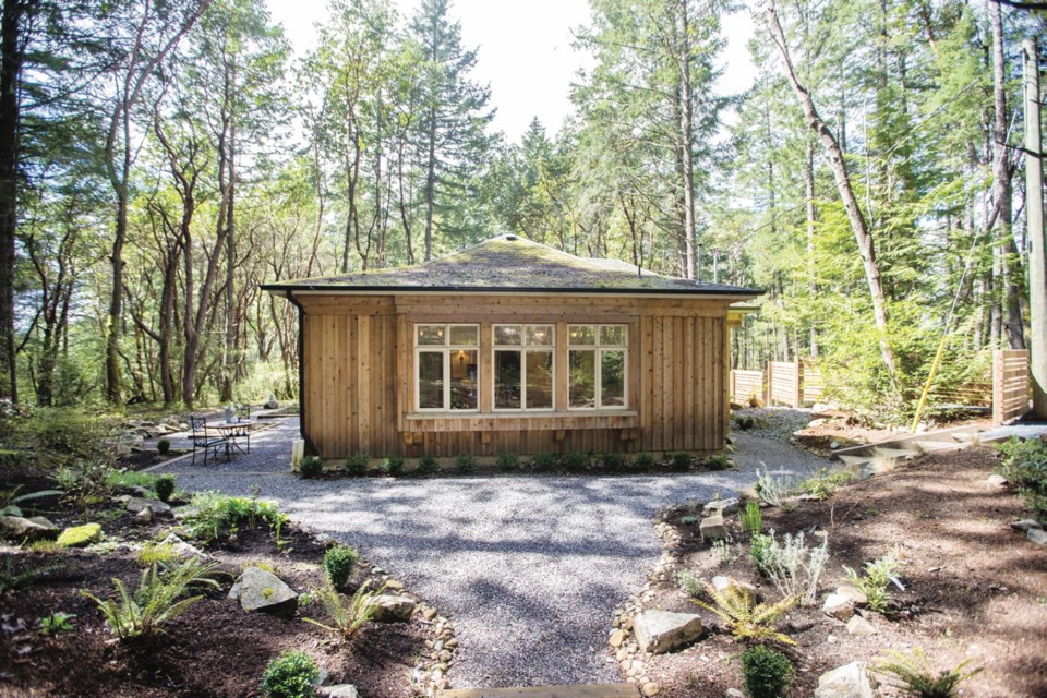 Most of the cottage is ringed in crushed quartz, for a satisfying crunch. The outdoor seating is nestled in an idyllic environment with mossy rocks and filtered light.