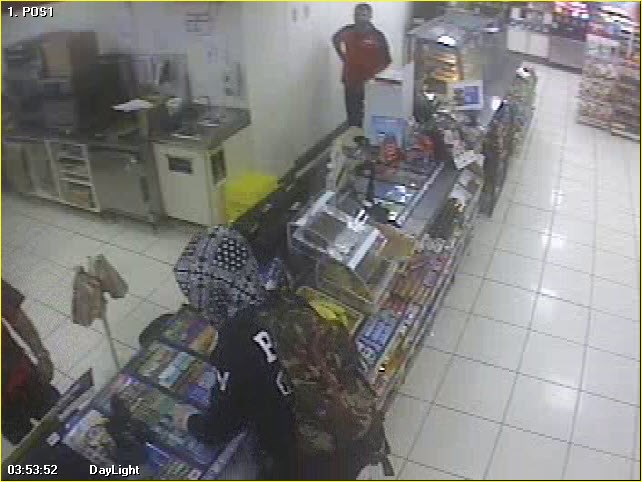 Video surveillance shows the suspect at the counter of the convenience store early this morning.