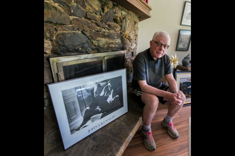 Retired prosecutor Scott Van Alstine at his home in Sidney, with a photo of one of his heroes, former U.S. president John F. Kennedy.