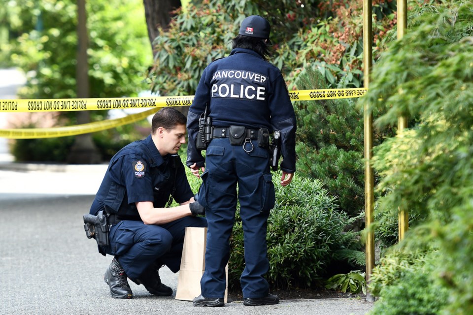 Police searched the area around a West End apartment building Monday. On Sunday, two people were fo