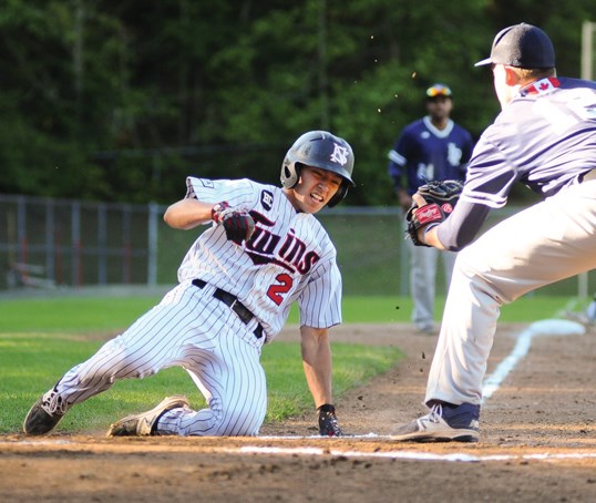 Alec Cumming of the North Shore Twins slides home during a recent game. The second baseman teamed with shortstop Steve Moretto to spur the attack for the Twins as they earned the B.C. Premier Baseball League regular season title. The playoffs start Saturday at Parkgate Park. photo Cindy Goodman, North Shore News