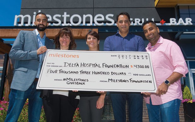 Shari Barr (second from left) and Lisa Hoglund (middle) of the Delta Hospital Foundation accept a $4,300 cheque from Milestones Grill and Bar in Tsawwassen Mills. Making the presentation are Justin Brar, Surinder Brar and Jaivin Khatri. Milestones raised the money at a recent grand opening party.