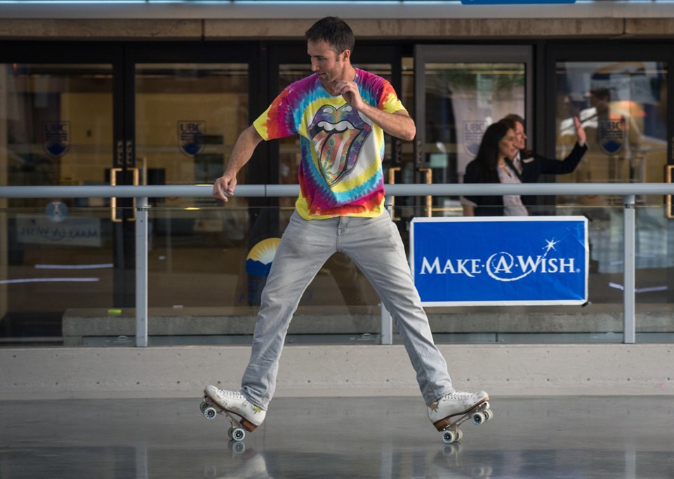 A roller skater busts out a spread eagle during Saturday’s F.U.B.A.R. public roller skate at Robson