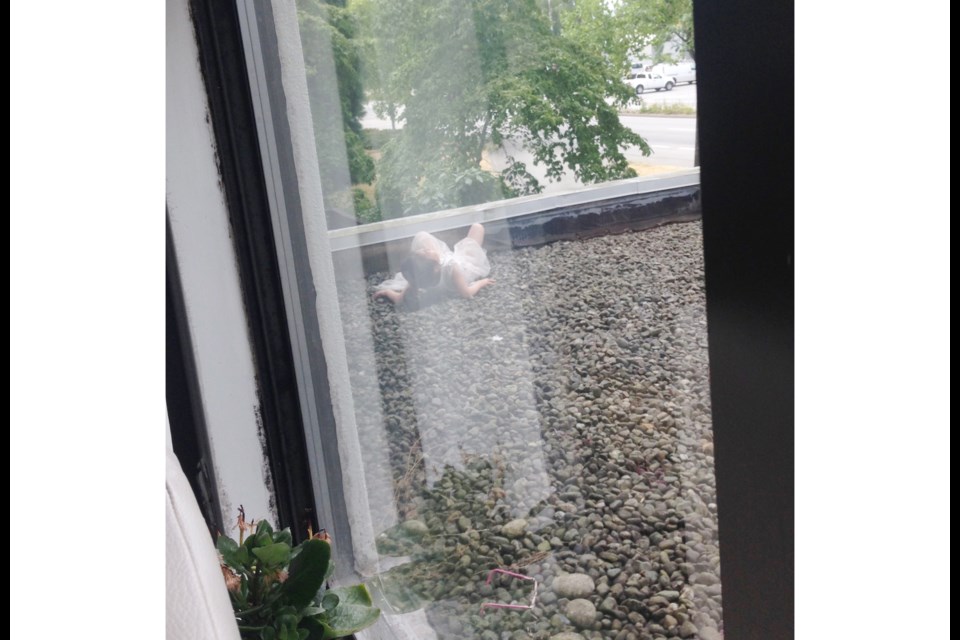 A photo taken from inside the second floor of the building shows the little girl moments after her dramatic plunge. Photo submitted by Victor Larichev