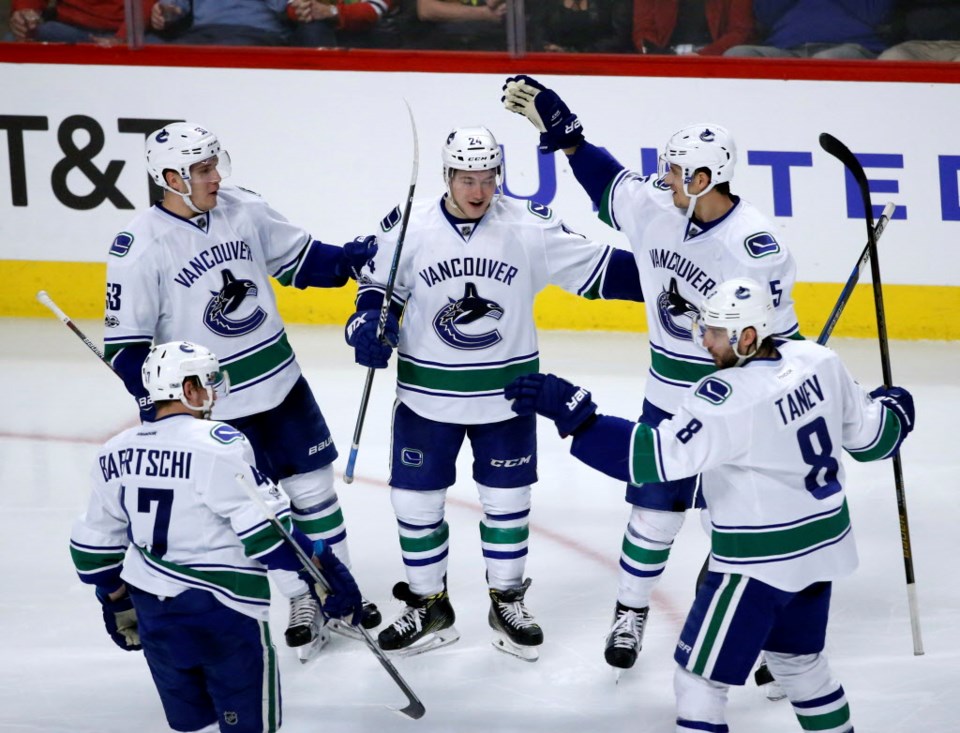 Reid Boucher celebrates a goal with his teammates