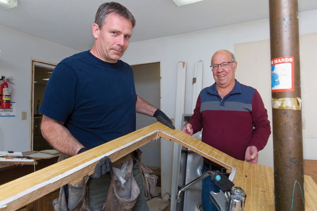 Doug Haller (left) of Cambium Contracting and project manager Don Phelps tear up a countertop at All Saints Anglican Church in Ladner as part of long awaited renovations, including installation of a commercial grade kitchen and updates to improve accessibility. The parishioners hope the upgrades will encourage local groups to use the facility as they seek to enable deeper connection within the community.