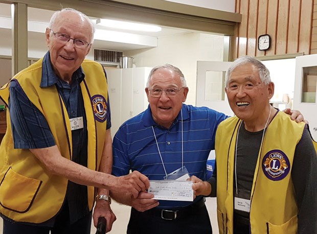 Walter Melnyk and David Morisawa representing the Tsawwassen - Boundary Bay Lions Club present a $1,000 cheque to Peter McTait, president of the Delta Stroke Recovery Society. The money will support society programs, which have expanded from a three-hour session on Tuesdays to include a walking program at Tsawwassen Mills on Wednesday mornings and a gymnasium program on Thursdays at the New Day Gym in Tsawwassen. Without the support of local partners, the society would not be able to offer that level of service.